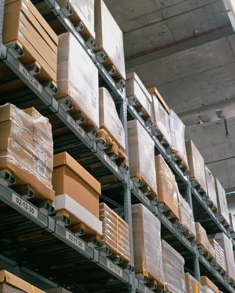 Steel pallet racking stacked with plain cardboard cases
